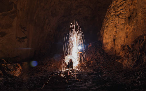 Low angle view of illuminated rock at night