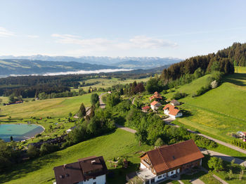 Scenic view of field and mountains against sky