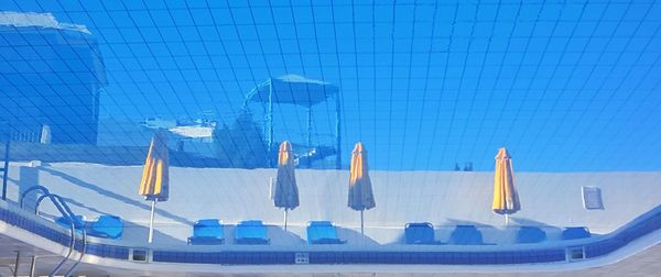 Clothes hanging against blue sky