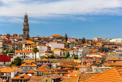 Buildings in town against sky