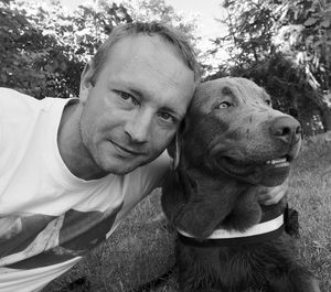 Portrait of smiling man with dog