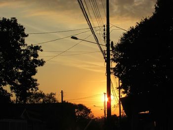 Low angle view of silhouette trees against sky during sunset