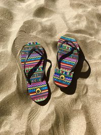 High angle view of shoes on sand