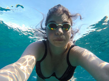 Portrait of young woman in swimming pool