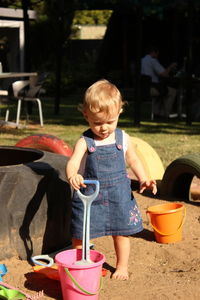 Girl playing with toys at ground