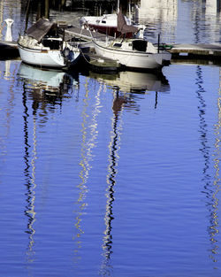 Boats moored in lake