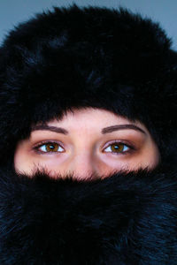 Close-up portrait of woman in winter