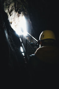 Rear view of man working