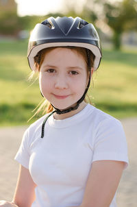 Portrait of boy standing on field