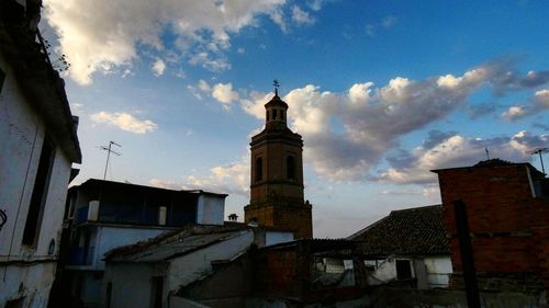 Low angle view of old buildings in city against sky