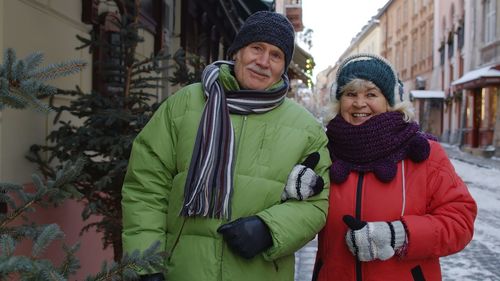 Senior couple standing outdoors during winter