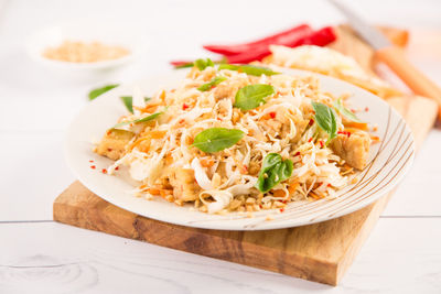 Close-up of pasta served in plate on table