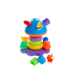 Close-up of multi colored toys against white background