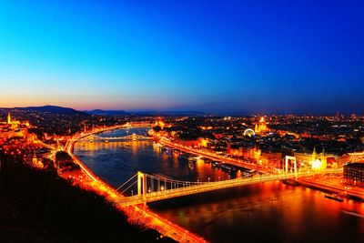 High angle view of bridge over river at night