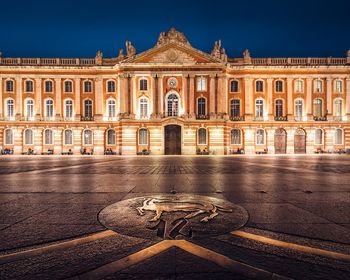 Facade of historical building at night