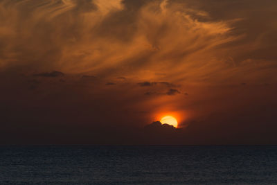 Scenic view of dramatic sky during sunset