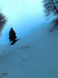 Scenic view of snow covered land against clear sky