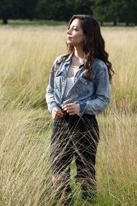 Young woman standing in field