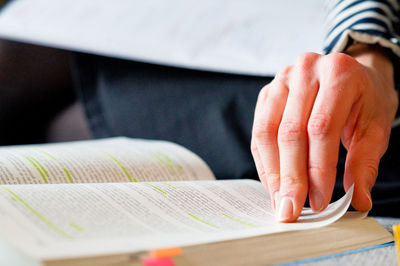 Close-up of man hand holding book