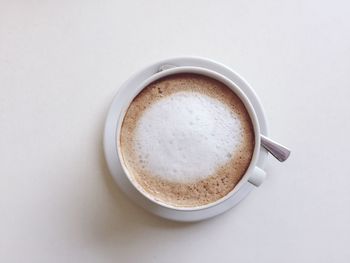 Directly above shot of coffee cup on white background