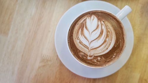 Close-up of coffee cup on table