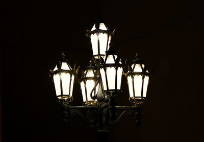 Low angle view of lit lamp