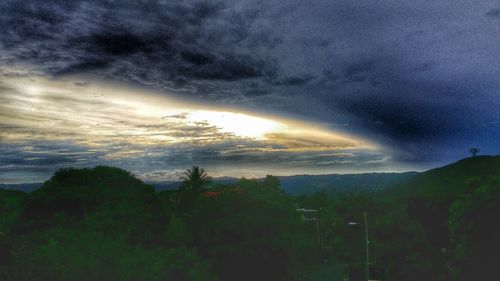 Scenic view of landscape against cloudy sky