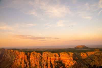 Scenic view of landscape against sky during sunset