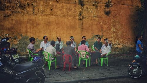 Group of people sitting on chair