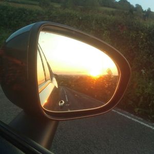 Reflection of road on side-view mirror