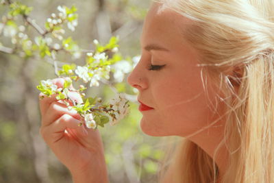 Close-up of woman holding flower