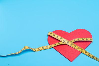 Close-up of heart shape against blue background