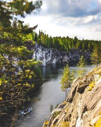 Scenic view of waterfall against sky