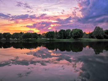 Scenic view of lake against sky at sunset