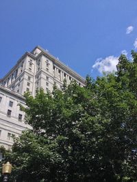 Low angle view of building against blue sky