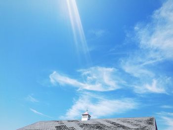 Low angle view of house against cloudy sky