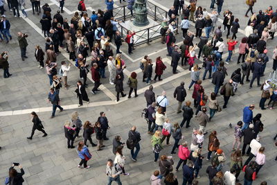 High angle view of people walking in city