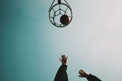 Low angle view of man standing against clear sky