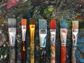 Close-up of paintbrushes on table