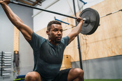 Man lifting weights in gym