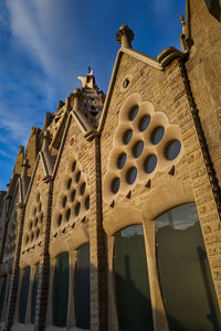 Low angle view of ornate building against sky