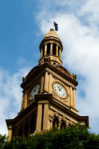 Low angle view of clock tower against sky