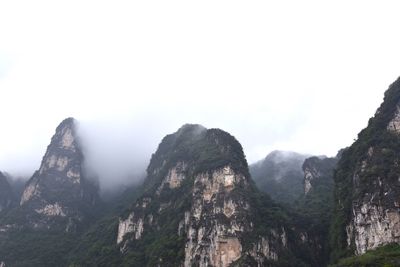 Panoramic view of mountains against clear sky