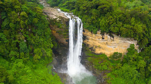 Beautiful waterfall in the rainforest. laxapanafalls, sri lanka.