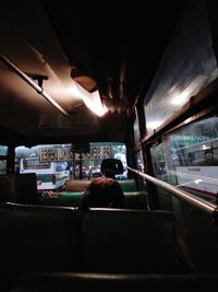 Rear view of people sitting in bus