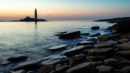 Scenic view of sea against sky during sunset