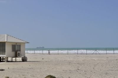 Scenic view of beach against clear sky