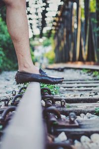 Low section of man on bicycle