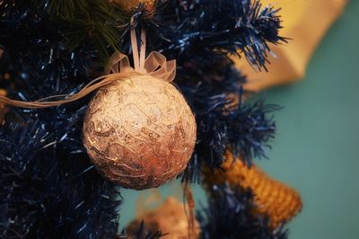 Golden ball in christmas fir tree with decoration. christmas and happy new year.