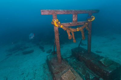 Rusty metallic structure by sea